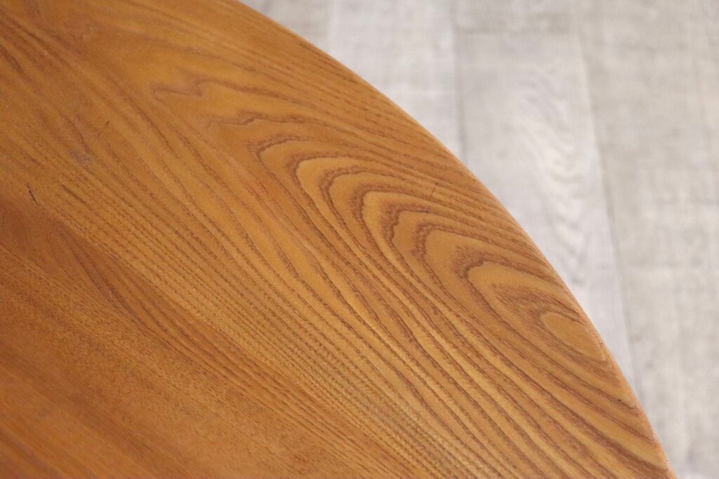 Pierre Chapo T21D dining table side view, showcasing its dynamic angled legs.