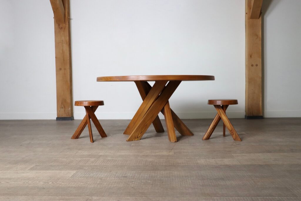 Pierre Chapo S31 stool paired with a matching table, creating a cohesive vintage furniture ensemble.