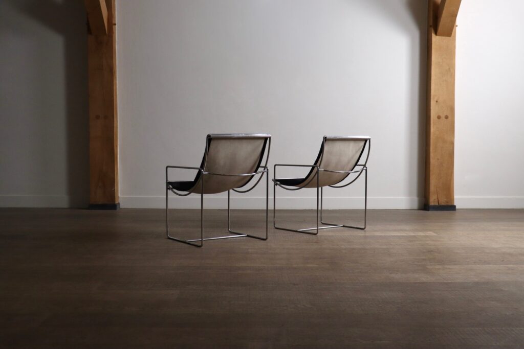 Rear view of Odile Mir Filo Lounge Chairs Model 203 with sculptural chrome construction.