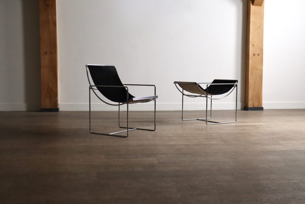 Rare Odile Mir Filo Model 203 lounge chairs with adjustable chrome frames and black pony seats.