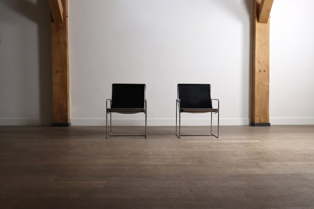 Pair of French 1970s Filo lounge chairs by Odile Mir for Prisunic in black pony.