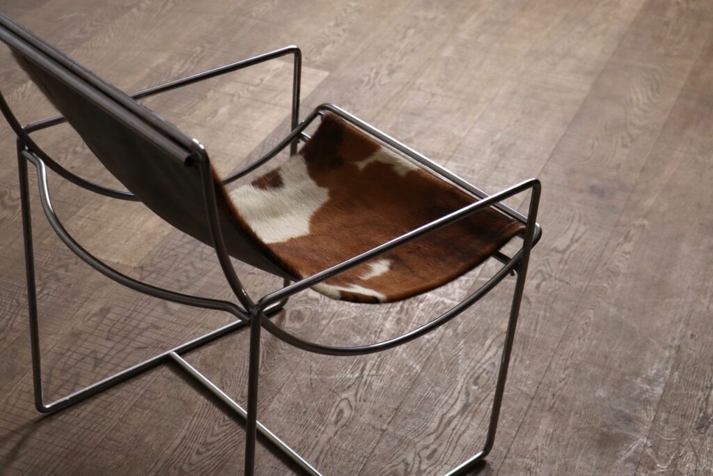 Original cowskin upholstery on the rare Filo Model 203 lounge chair by Odile Mir.