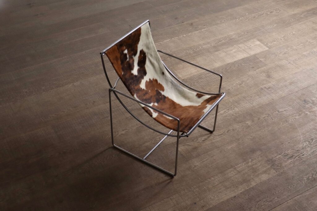 Odile Mir Filo lounge chair in original cowskin upholstery, manufactured by Prisunic in 1971.