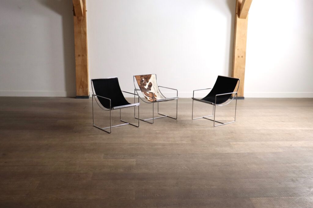 Odile Mir Model 203 Filo lounge chairs for Prisunic, shown in original black pony upholstery.