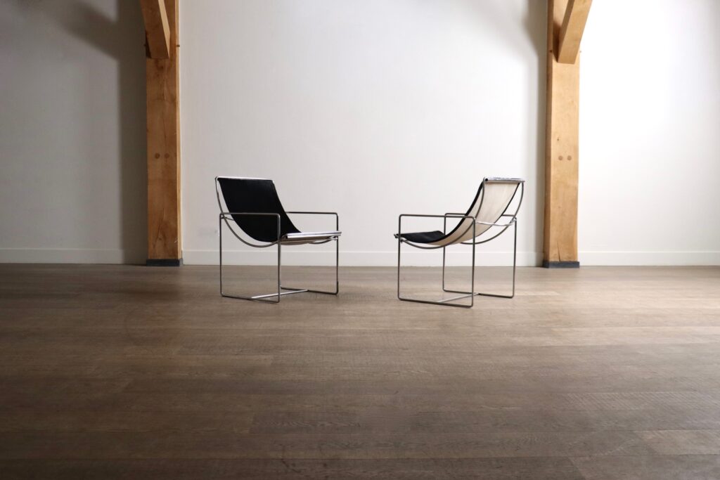 Odile Mir Filo Lounge Chairs Model 203 for Prisunic with black pony upholstery and chrome frames.