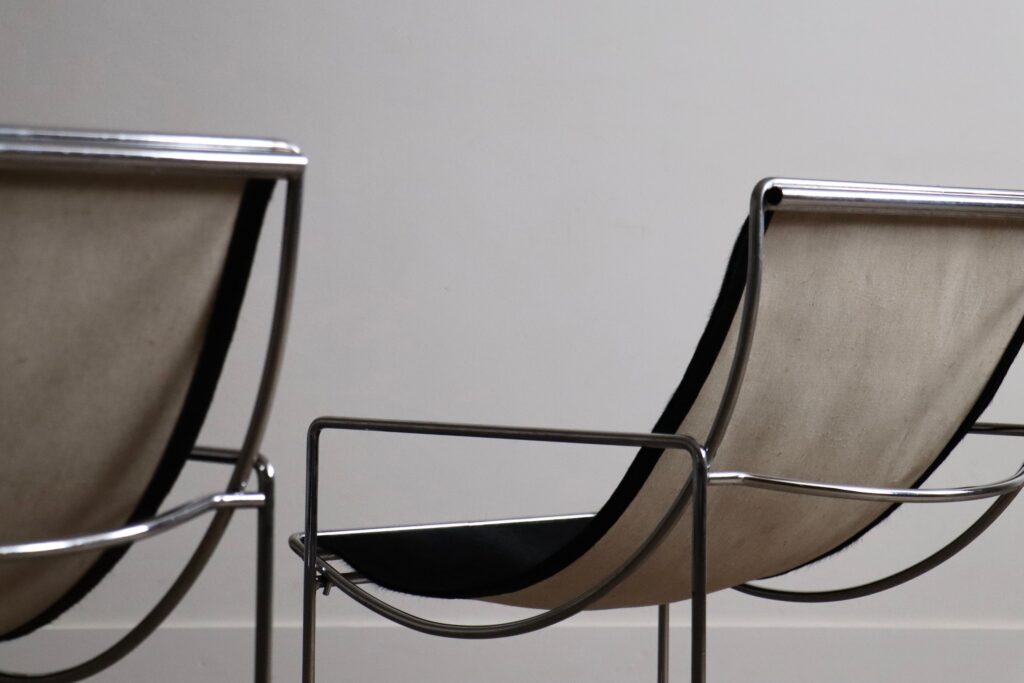 Detail of the black pony upholstery and chrome frame on the Odile Mir Filo chair.