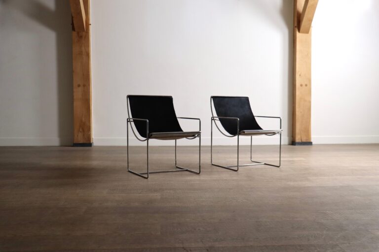 Pair of Odile Mir Filo Model 203 lounge chairs for Prisunic, France 1971, with chrome frames and black pony upholstery.