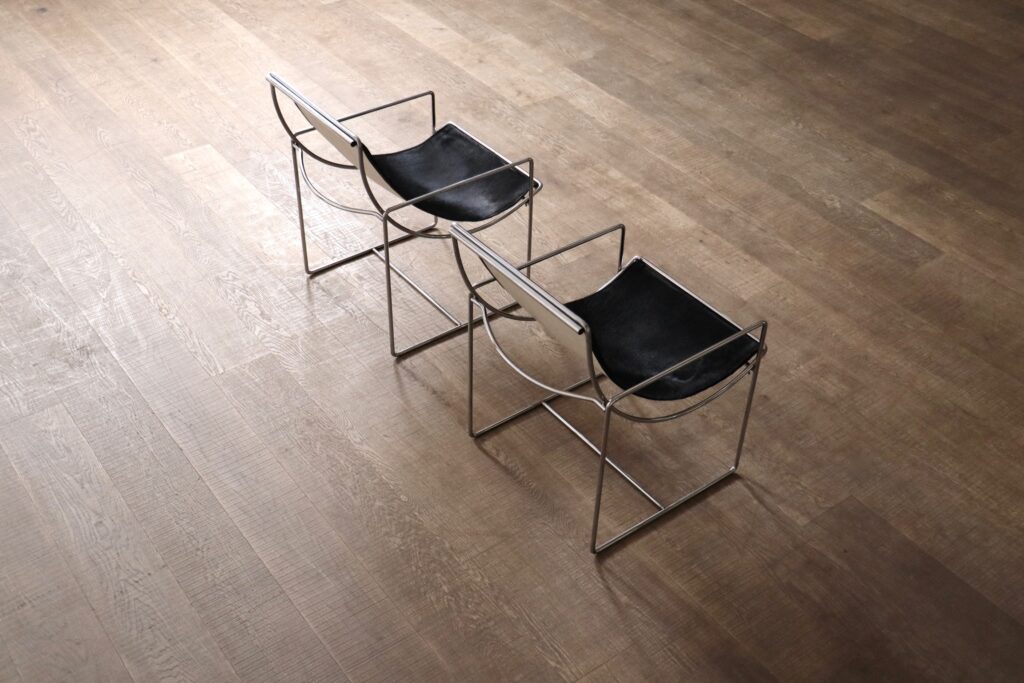 Pair of French 1970s Filo lounge chairs by Odile Mir for Prisunic in black pony.