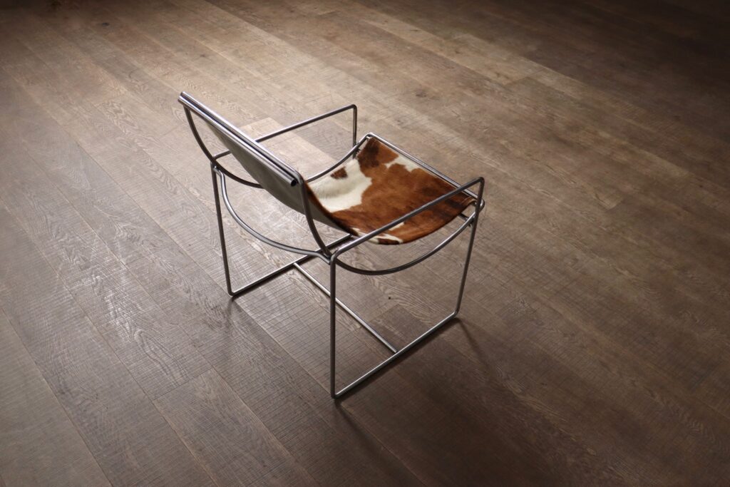 Rare Odile Mir Filo Lounge Chair Model 203 for Prisunic with chrome-plated frame and cowskin upholstery.