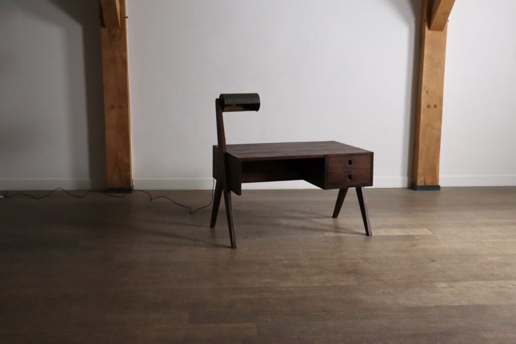 Front view of a Pierre Jeanneret writing desk with integrated light