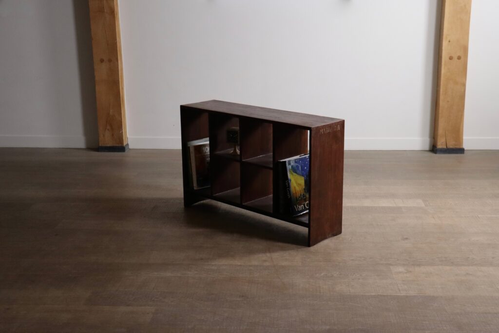 Side view of the Pierre Jeanneret six-hole storage rack