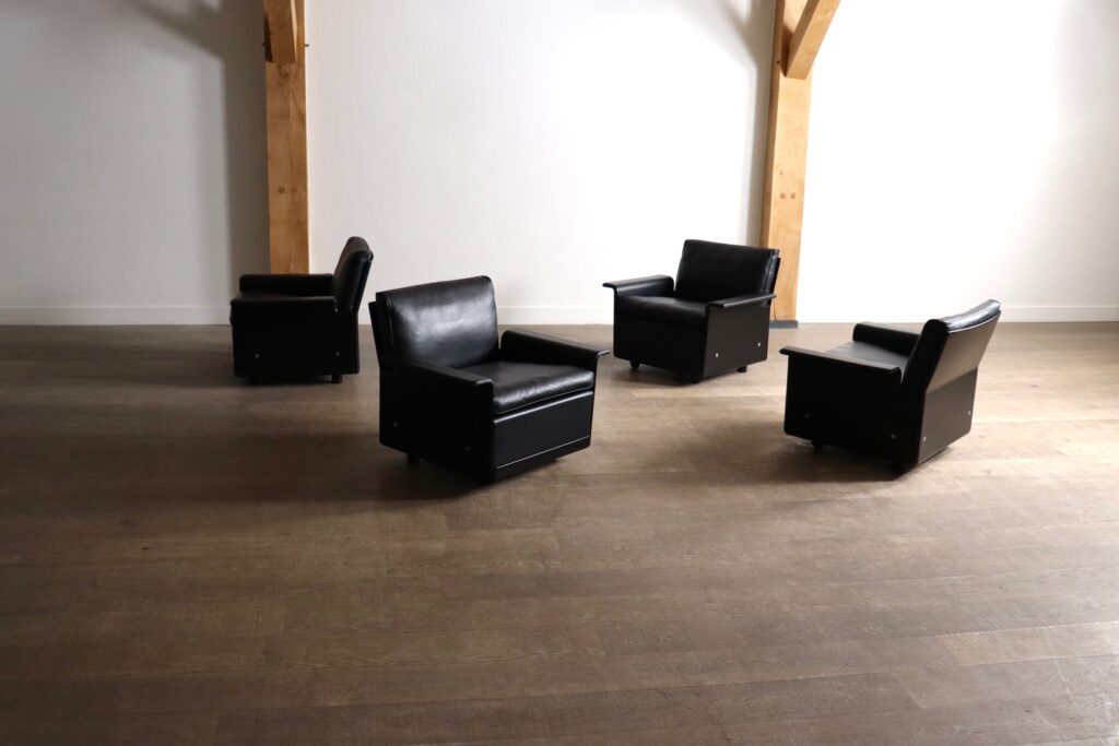 Black leather Vitsœ lounge chairs from the Model 620 Chair Programme