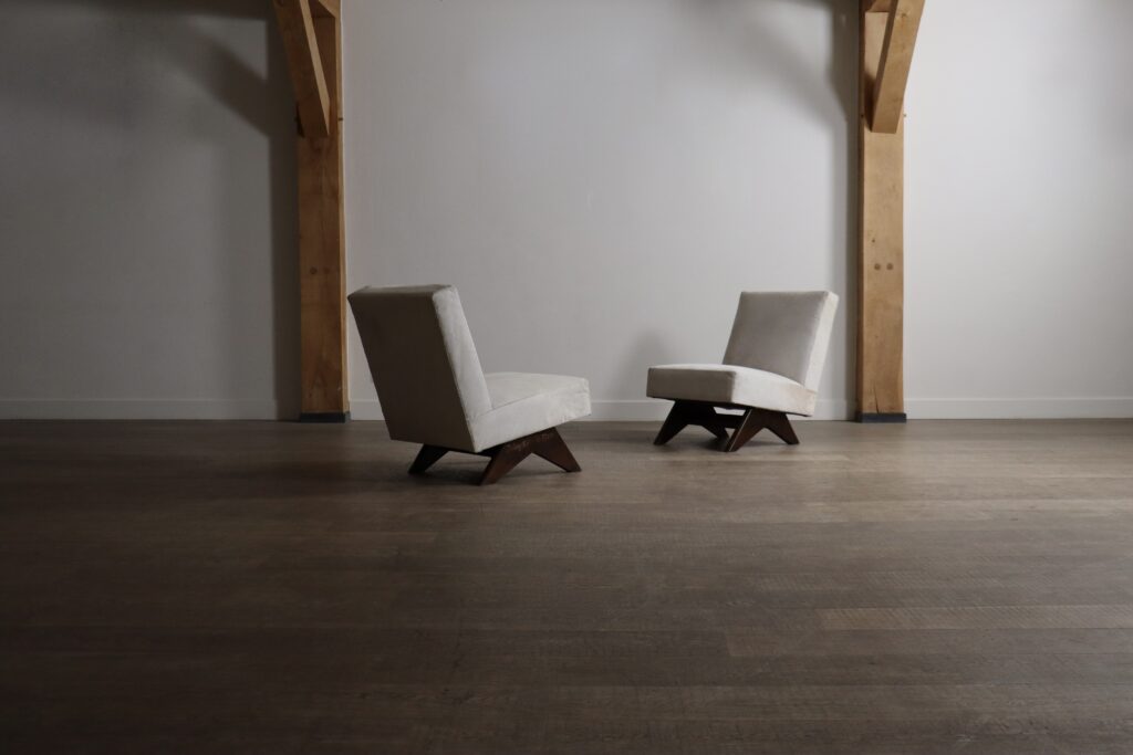 Pair of Chandigarh Fireside chairs by Pierre Jeanneret in teak and cowhide