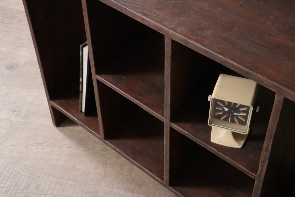 Angled view of a Pierre Jeanneret Chandigarh file rack in Indian rosewood