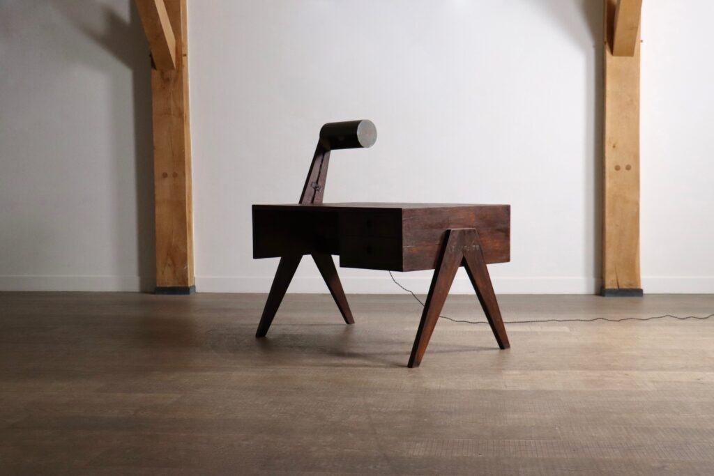 Angled view of a Pierre Jeanneret desk from Punjab Engineering College