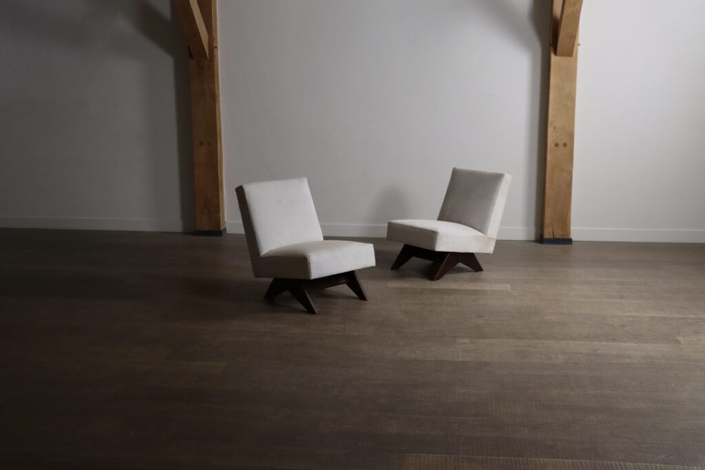 Front view of two Pierre Jeanneret Fireside chairs designed for Chandigarh