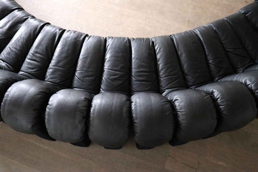 Detail of black leather upholstery on vintage De Sede DS 600 sofa