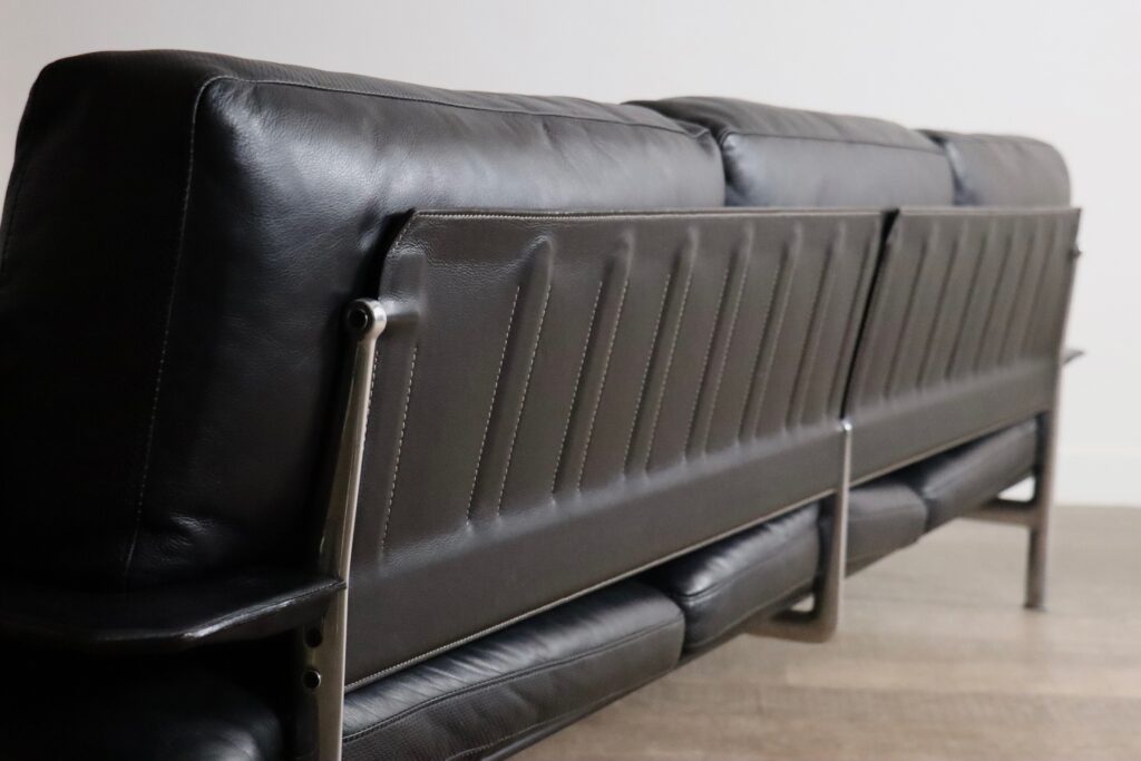 Rear view of the Diesis sofa showing its finished leather back structure